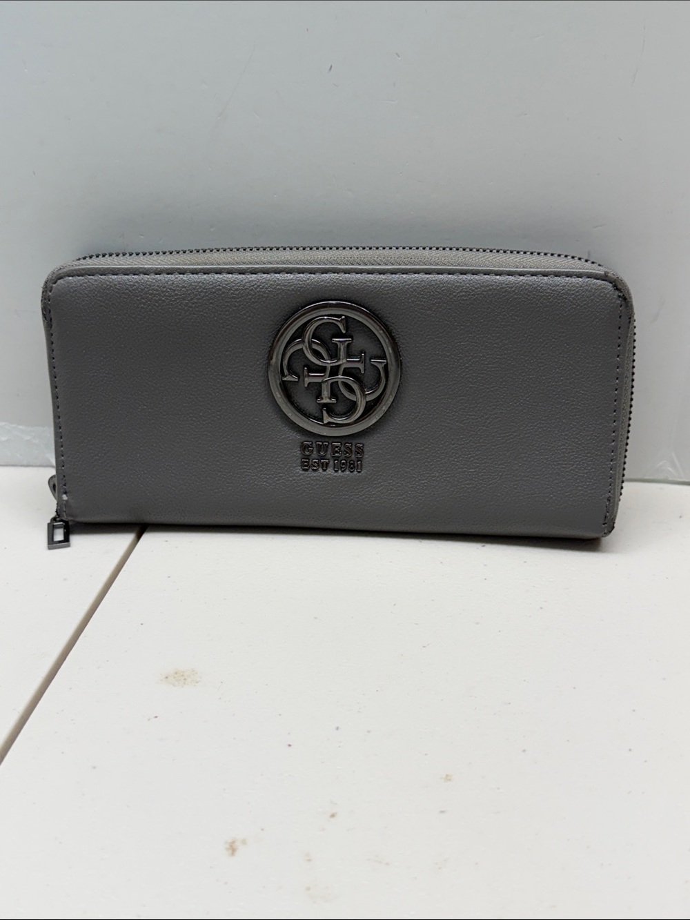 Guess Gray Logo Zip Wallet. Has some damage